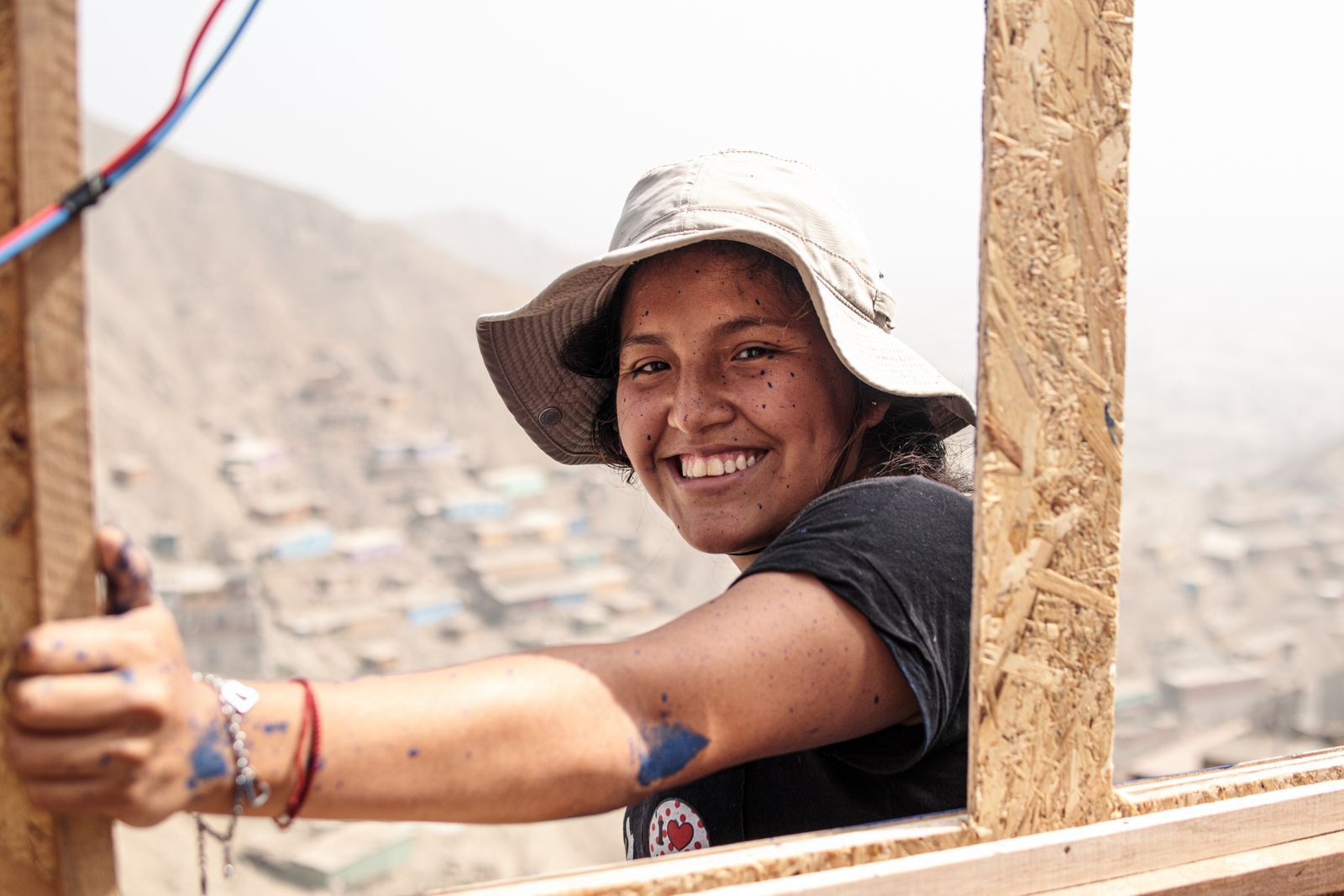 A volunteer smiling on a rebuild site